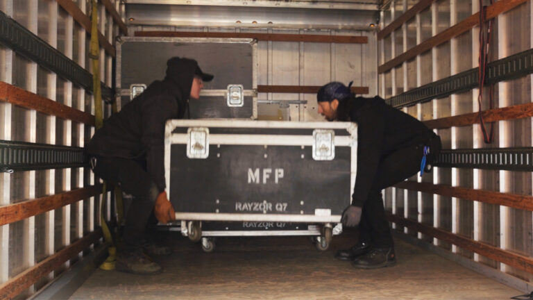 Tony and Andrew lifting road case